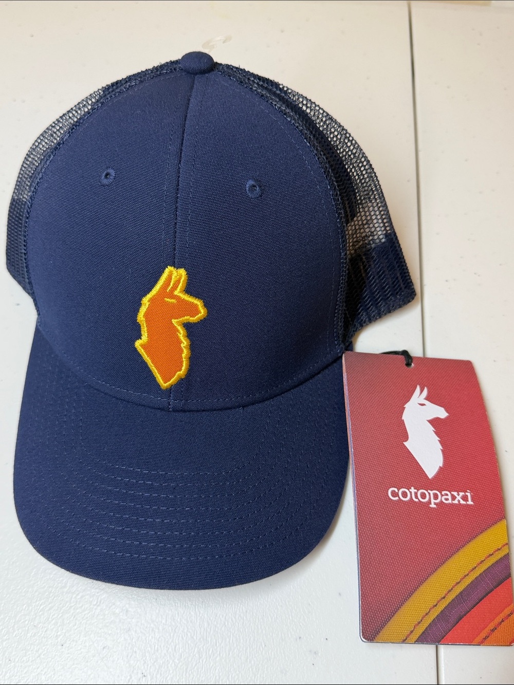 Cotopaxi Llama Trucker Hat, SnapBack NWT. Maritime Blue